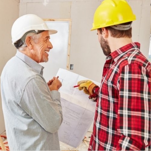 Two men reviewing construction plans for home remodel.