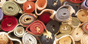 Rolled up rugs in storage.