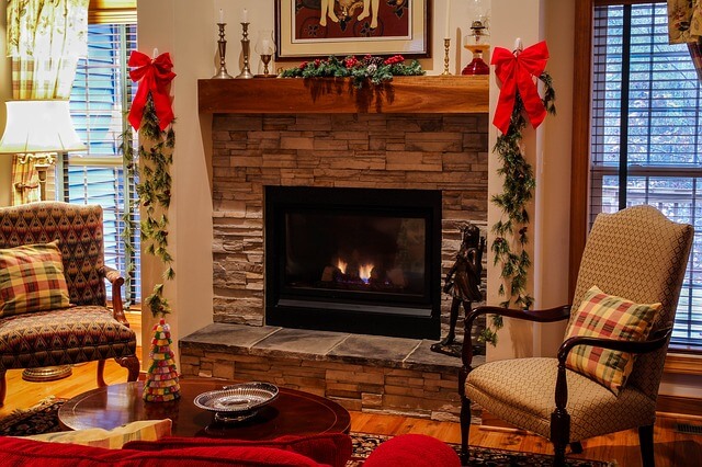 Fireplace in a home decorated for Christmas holiday.