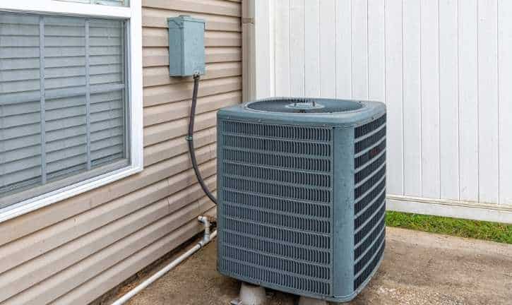 Air condition sitting outside of a home in Boston.