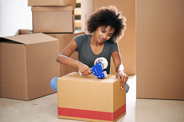 A student packing up her room.