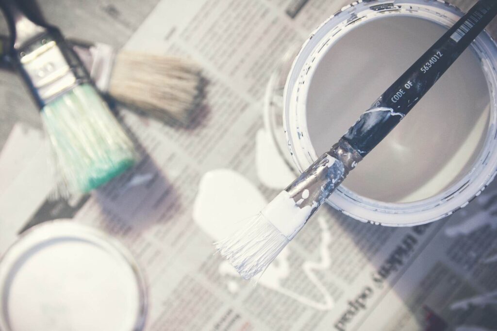 Paint can on newspaper