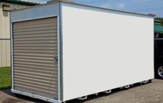 Portable storage container in a driveway.