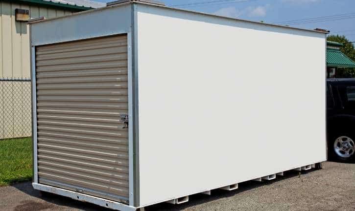 Portable storage container in a driveway.