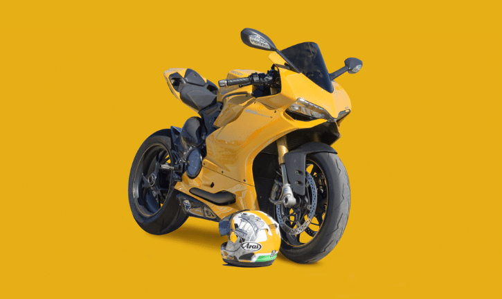 Yellow motorcycle with a yellow background.