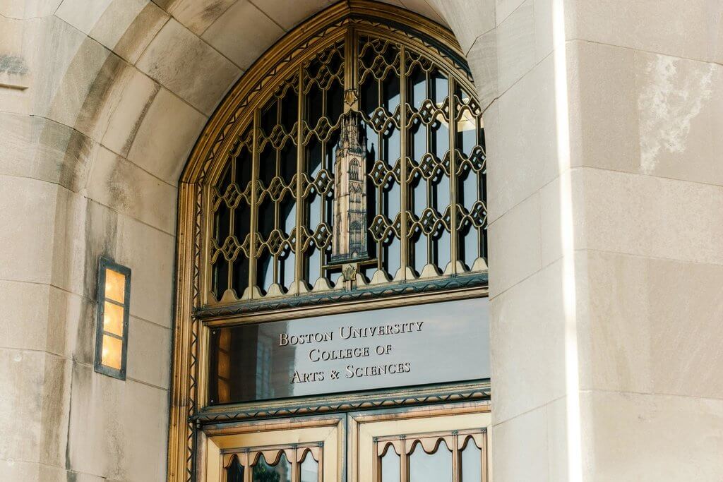 door with a sign above it reading 'boston university college of arts & sciences'.