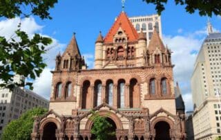 Tall brick building with spires.