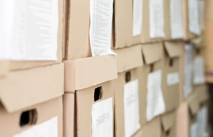 stack of cardboard boxes with lids for document storage